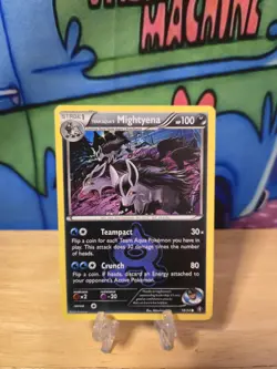 2015 Pokemon XY - Double Crisis Team Aqua’s Mightyena #18 NM Sleeve & Top Loader - Image 1