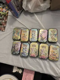 10 Pokemon TCG: Scarlet & Violet Prismatic Evolutions Mini Tins - Factory Sealed - Image 1