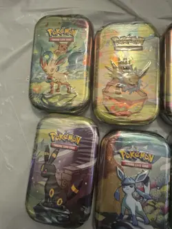 10 Pokemon TCG: Scarlet & Violet Prismatic Evolutions Mini Tins - Factory Sealed - Image 2