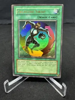 Yu-Gi-Oh! Creature Swap Legacy of Darkness LOD-081 1st Edition Holo Spell - Image 1
