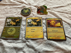 Pokemon Pikachu Cosmos Holo Pokemon Day 51/152 + Coin, pin 2 more Pikachu cards - Image 1