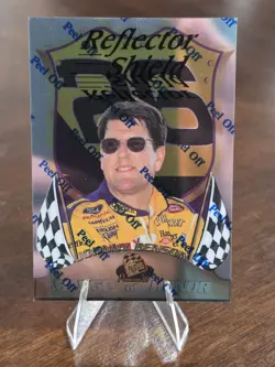 1999 Press Pass Premium - Badge of Honor Johnny Benson Jr. #BH8 Reflectors /1350 - Image 1