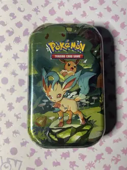 POKEMON TCG PRISMATIC EVOLUTIONS LEAFEON MINI TIN PACKS, COIN,ART CARD SEALED - Image 1