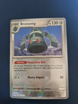 Pokemon TCG Bronzong Prismatic Evolutions 067/131 Reverse Holo Pokeball - Image 1