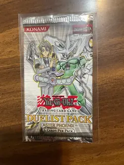 yugioh duelist pack aster phoenix 1st edition booster pack sealed and in sleeve - Image 1