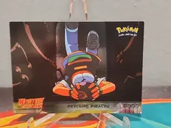 1999 Topps Pokemon the First Movie Rescuing Pikachu Silver Foil #30 Blue Logo - Image 1