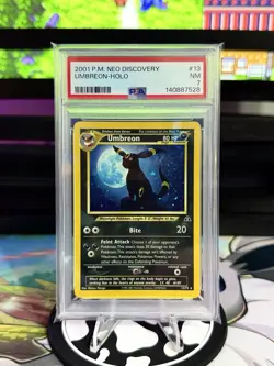 PSA 7 NM UMBREON-HOLO #13/75 2001 POKEMON NEO DISCOVERY 🌙 - Image 1