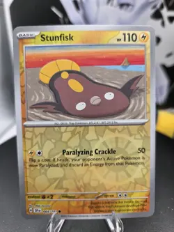 Stunfisk 064/191 Sv08: Surging Sparks Reverse Holo - Free Shipping - NM Pokemon - Image 1