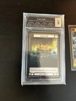 Flesh and Blood - Fool's Gold Cold Foil Promo PCG 9 + Bonus Ketch Treasure Card - Image 2