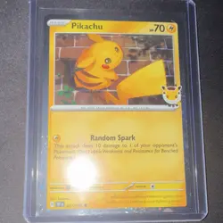 Pikachu 30th Anniversary Holo Card with Pikachu looking at a swirl in the sky - Image 1