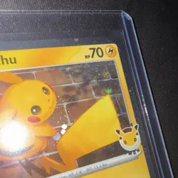 Pikachu 30th Anniversary Holo Card with Pikachu looking at a swirl in the sky - Image 2