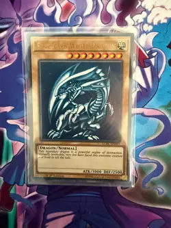 YUGIOH Ultra Rare Blue-Eyes White Dragon LCKC-EN001 1st Edition - Image 1