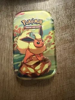 Pokemon Prismatic Evolutions Mini Tin Evee FLAREON New Sealed - Image 1