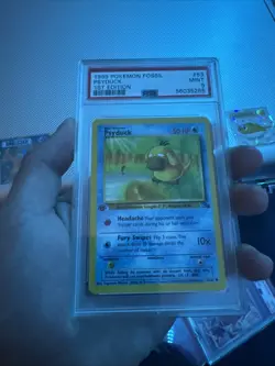 Pokemon 1999 Fossil Psyduck 53/62 1st Edition Common PSA 9 English TCG - Image 1