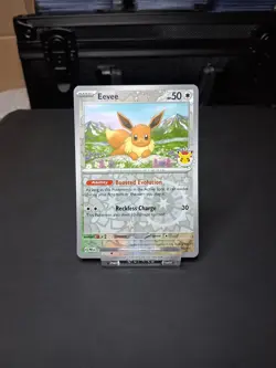 Eevee - (Pokemon Day 2025) (Reverse Cosmos Holo) 074/131 - Image 1