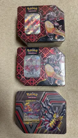 Pokemon TCG Paldean Fates Charizard Tin x2 And Giratina Tin Lot Sealed - Image 1