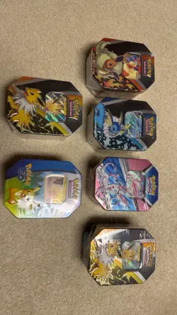Pokemon TCG 6 Tin Sylveon Jolteonx2 Flareon Vaporeon Pikachu Go Sealed Lot - Image 1