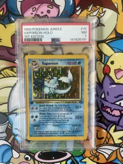 Pokemon TCG Vaporeon 12/64 Jungle 1st Edition Holo PSA 7 - Image 1