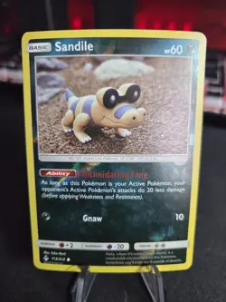 Pokemon TCG Sandile 113/214 Sm Unbroken Bonds Reverse Holo Yuka Morii Art NM - Image 1