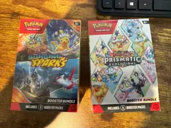 Pokemon Prismatic Evolutions and Surging Sparks Booster Bundle - Image 1