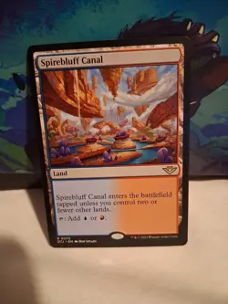 Magic Spirebluff Canal [Outlaws of Thunder Junction] Near Mint MTG - Image 1
