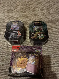Pokemon Paldean Fates 2 Tins Iron Threads, Great Tusk & Tech Sticker Fidough - Image 1