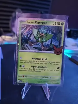 GameStop promo cosmos holo Teal Mask Ogerpon 024/167 Pokemon card NM - Image 1
