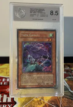 Yugioh Yata-Garasu LOD-000 1st Edition Secret Rare Heavy Foilbleed PSA PGS 8.5 - Image 1
