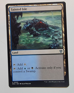Tainted Isle - Commander: Murders at Karlov Manor 🔥 BUY 2 GET 1 FREE 🔥 NM MTG - Image 1