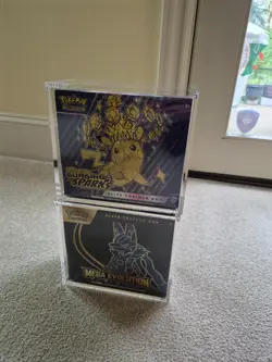 Pokemon Lucario Etb + Surging sparks etb with acrylic cases, slight tears - Image 1