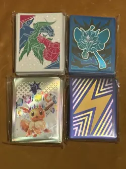 Pokemon TCG Card Sleeves 4 Pack Cosmic Eclipse/Prismatic/Surging/Twilight - Image 1