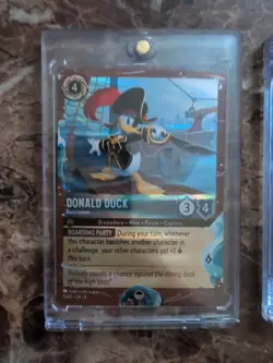 Disney Lorcana TCG Treasure Exclusive Donald and Daisy - Image 2