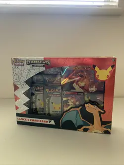 POKEMON CELEBRATIONS & EVOLVING SKIES LANCE’S CHARIZARD V BOX SEALED - Image 1