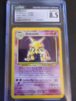 1999 WOTC Pokemon Base Set Alakazam 1/102 Unlimited Holo TCG CGC 8.5 NM/MINT+ - Image 1