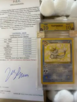 Vaporeon 28/64 GRADED 10 GEM MINT PGC old pokemon card 1999 - Image 1