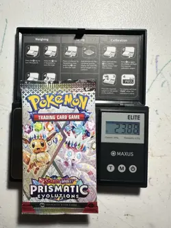 Pokemon TCG Prismatic Evolutions Booster Pack 23.88g- Heavy - Image 1
