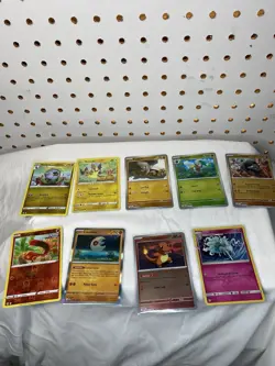 Pokemon TCG Evolving Skies Mixed Card Lot Metal Tin Case Metapod Charmander - Image 1