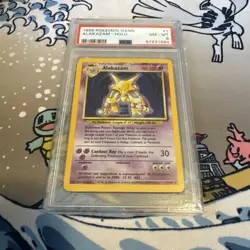 1999 Pokemon Base Set Alakazam Holo 1/102 PSA 8 - Image 1