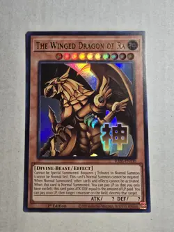 YuGiOh! The Winged Dragon of Ra RA05-EN130 STAMPED ART Rarity 5 In Hand - Image 1