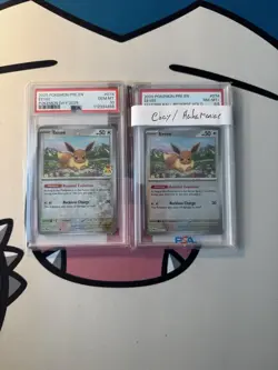 2025 POKEMON PRE EN-PRISMATIC EVOLUTIONS POKEMON DAY 2025 #074 EEVEE PSA 10 - Image 1