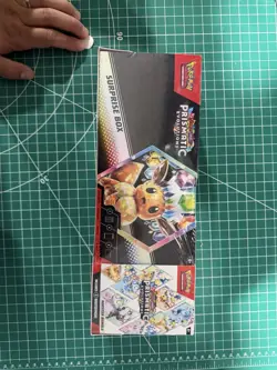 Pokemon TCG Sam's Club Prismatic Evolutions Surprise Box + Booster Bundle - Image 1