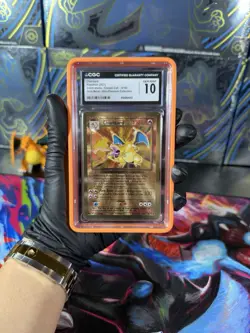 CGC 10 - Charizard 4/102 Celebrations UPC Gold Metal Pokemon Promo Card - Image 1