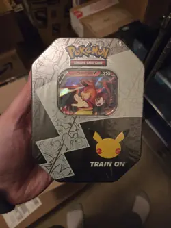 Pokemon TCG Celebrations Lance’s Charizard V Tin 25th Anniversary Factory Sealed - Image 1