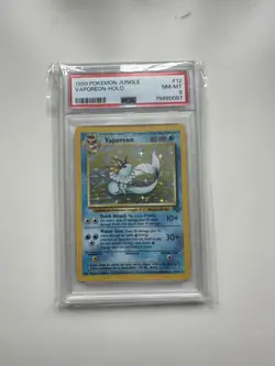 Pokemon Tcg Vaporeon Holo Rare TCG Card 12/64 Jungle Unlimited, PSA 8 - Image 1