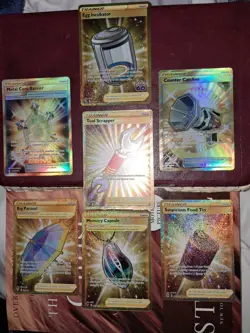 Lot Of 7 Gold Secret Rare Pokemon Trainer Cards - Image 1