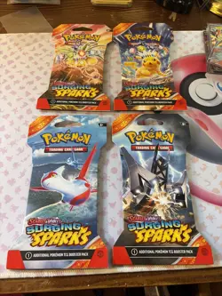 Pokemon TCG Surging Sparks Sleeved pokemon Booster Packs Sealed Lot Of 4. - Image 1