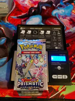 Pokemon Scarlet & Violet Prismatic Evolutions Sealed Booster Weighs 22.29 grams - Image 1
