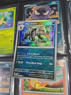 Pokemon Houndoom 063/131 Sv: Prismatic Evolutions Masterball Pattern - Image 1