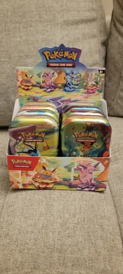 Prismatic Evolutions Empty Mini Tin Set Of 9 with Display + 9 Coins /Art Cards - Image 1