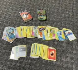 Random Lot of Pokemon Cards (Includes Tin and Mini Binder) - Image 1